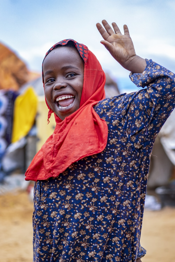 A Somali girl smiling at the camera